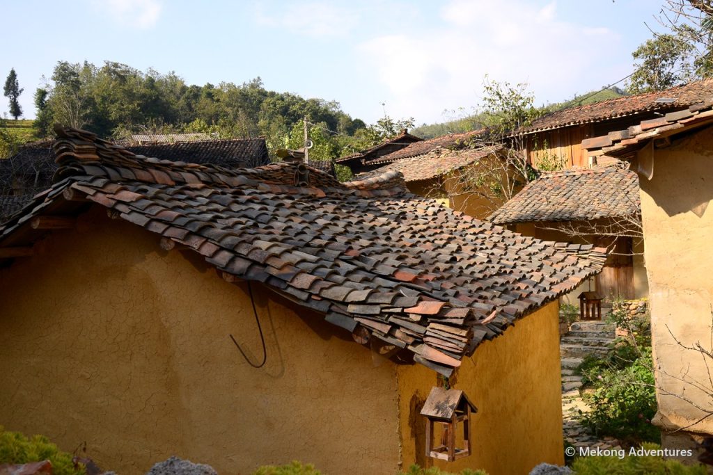 Old clay-tile roof of a rammed-earth house in Then Pa, Ha Giang