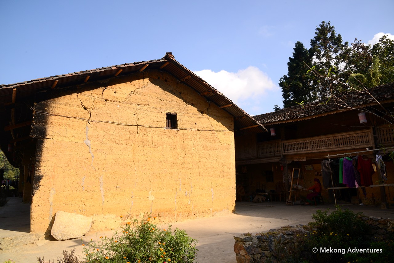 Rammed-earth house under a blue sky in Then Pa village, Ha Giang