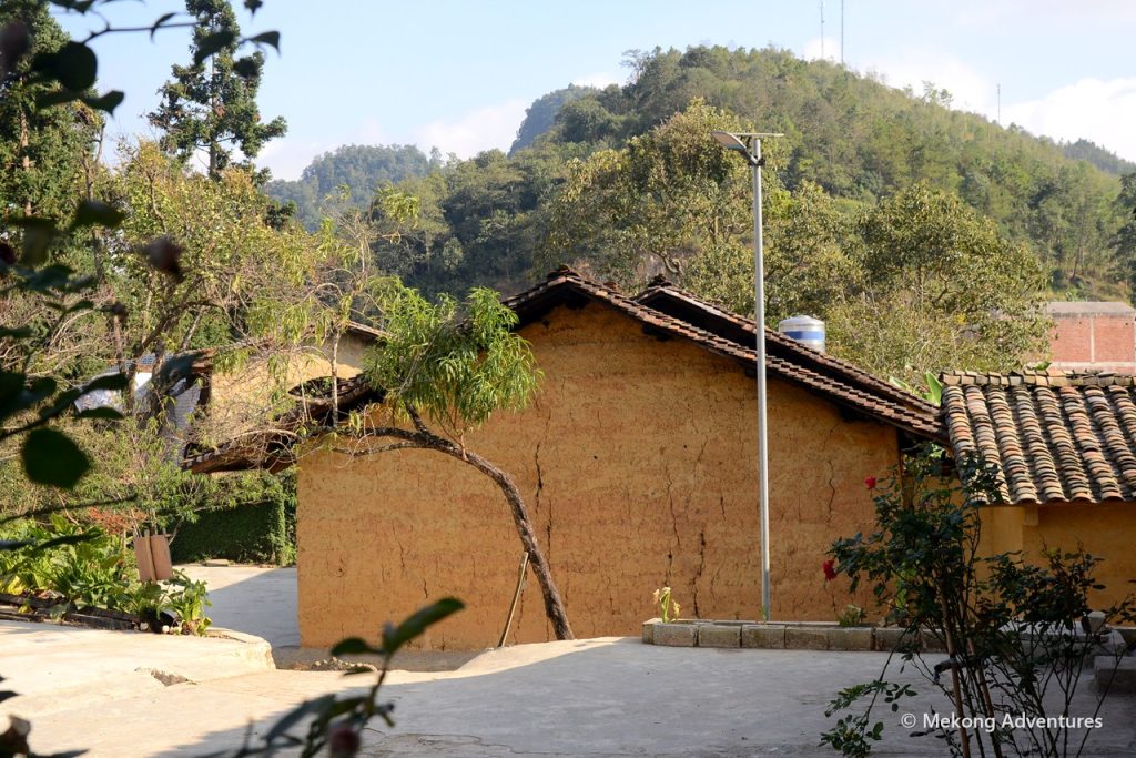 Rammed-earth house among green hills in Then Pa, Ha Giang