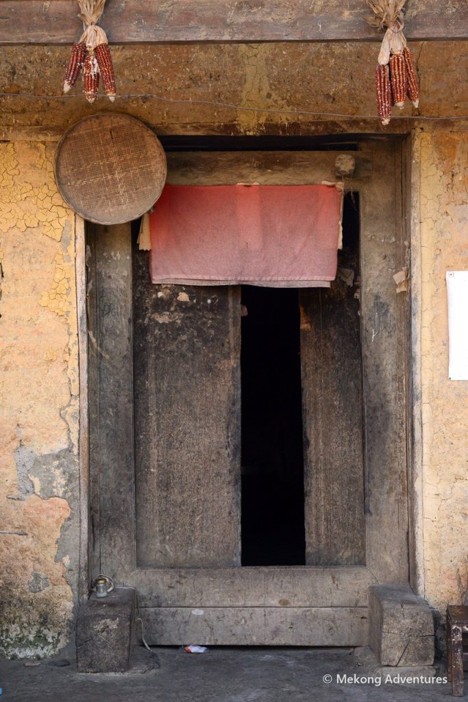 Wooden door of a traditional house in Then Pa, Ha Giang